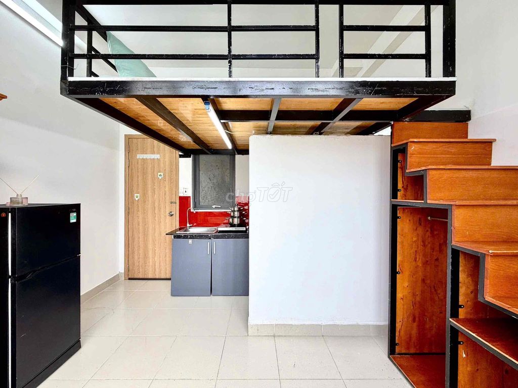The balcony is full of furniture in blue.