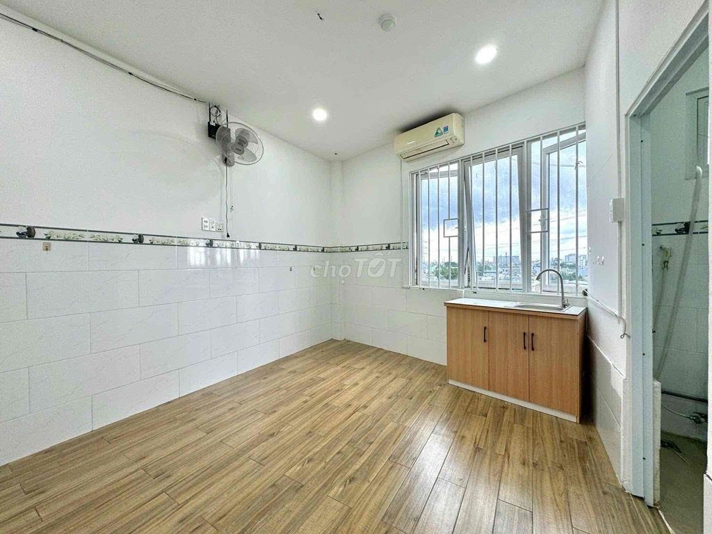 Rent a cheap room 50 yards from the gate.