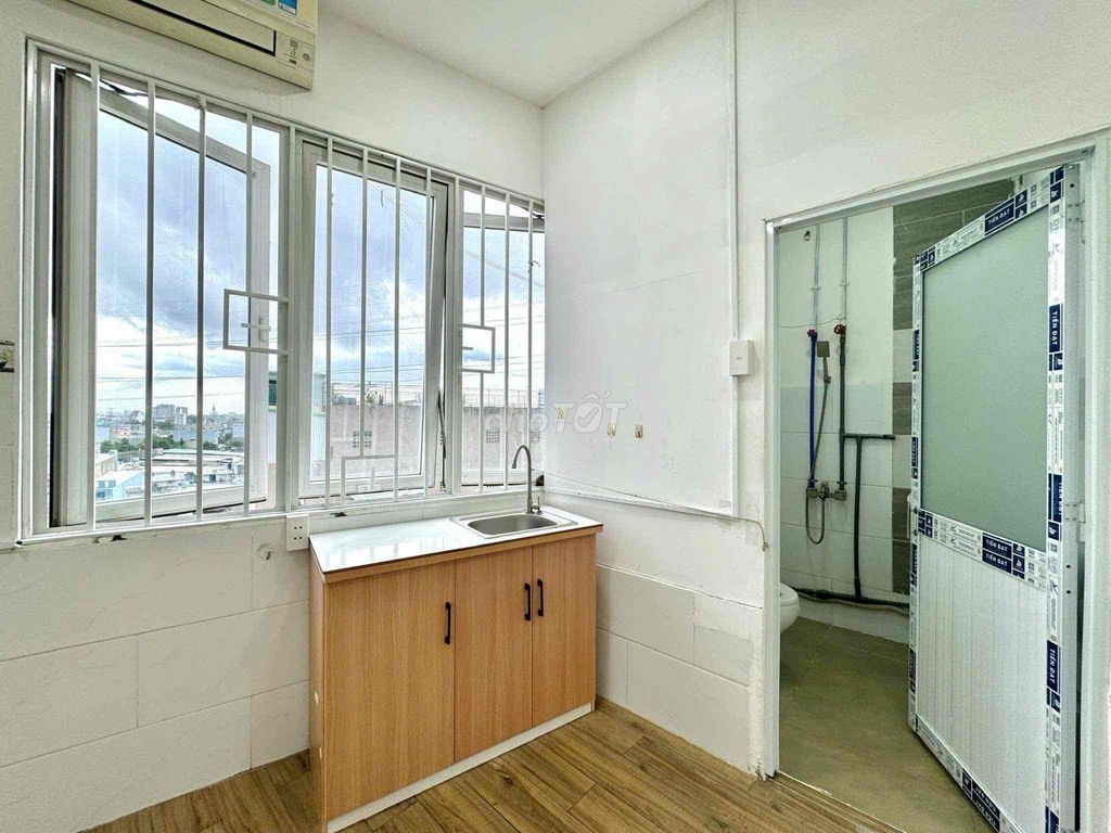 Rent a cheap room 50 yards from the gate.