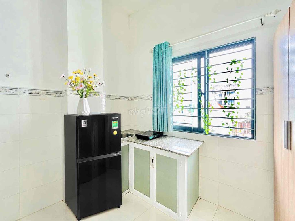 The window window door is full of furniture near aeon in low-priced public school