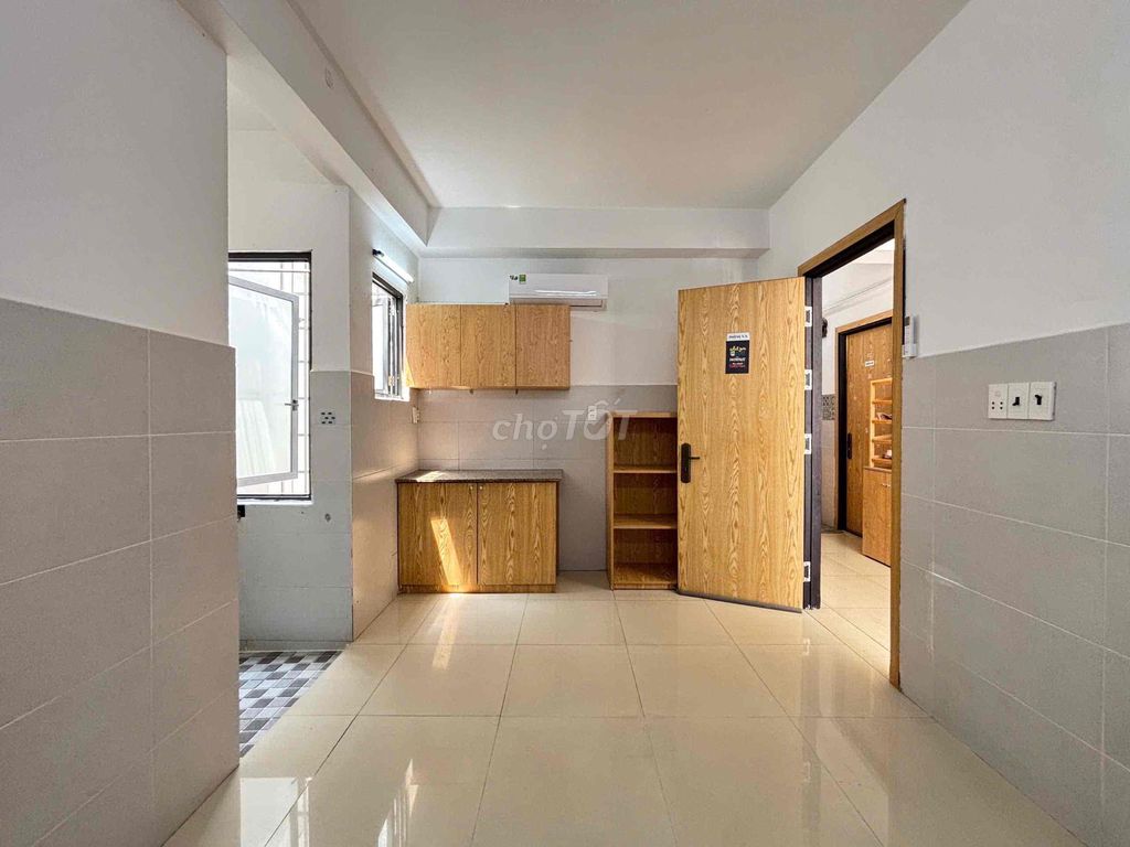 The studio near the department store is cheaply expensive full of furniture is empty