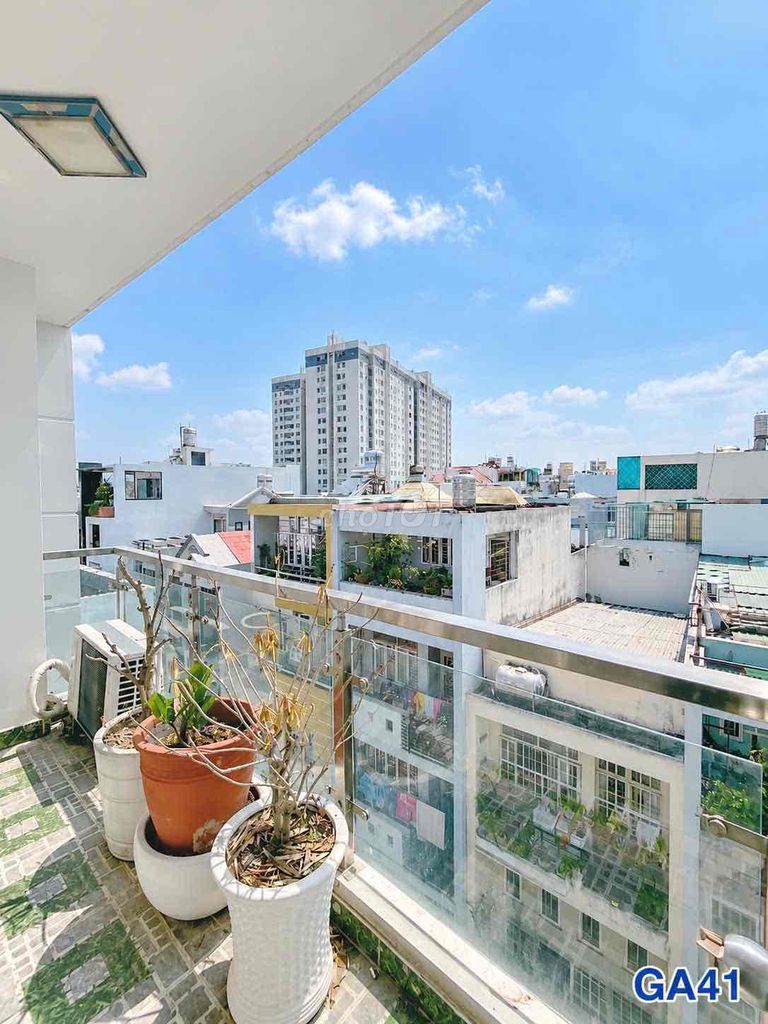 Cool, empty balcony studio.