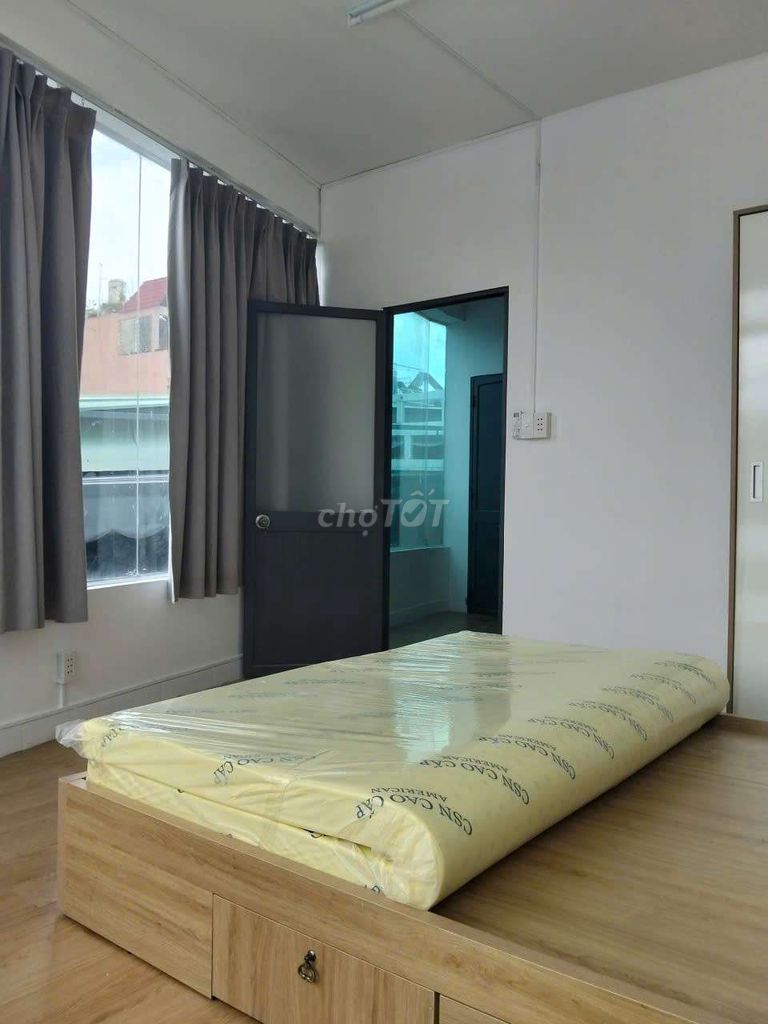 New service apartment 100% full interior, solar window, Huỳnh Tấn Phát front