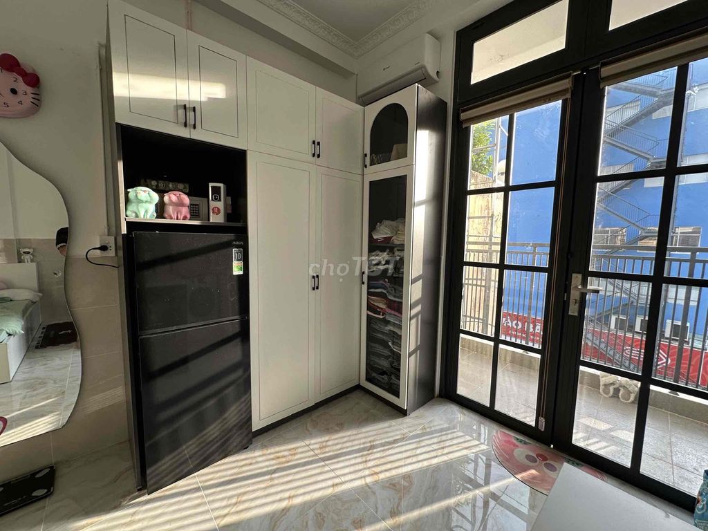 The studio apartment, the balcony.