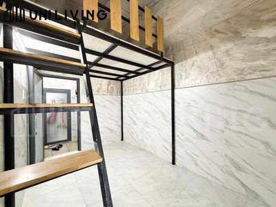 In the open room at 440 Building Man with a cheap elevator