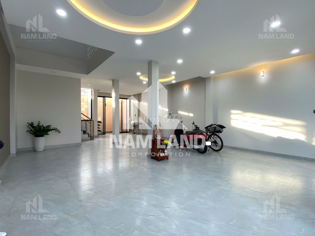 It's a super cool new house. Three-story garage. Five-room big office.