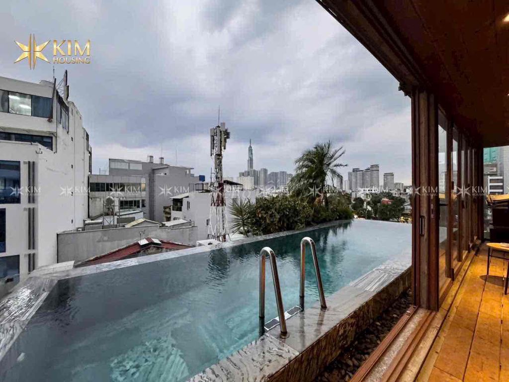 A hot tone bedroom - a large living room - a fancy pool