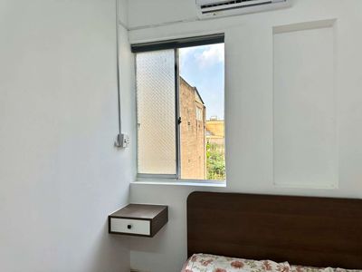 Two bedrooms full of empty window interiors near a soft bridge