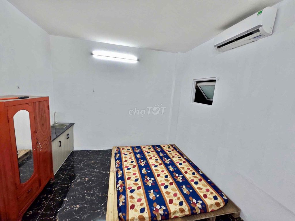 Nice new living room with air conditioning-- Tạ Quang Bửu Street, District 8 for 4.