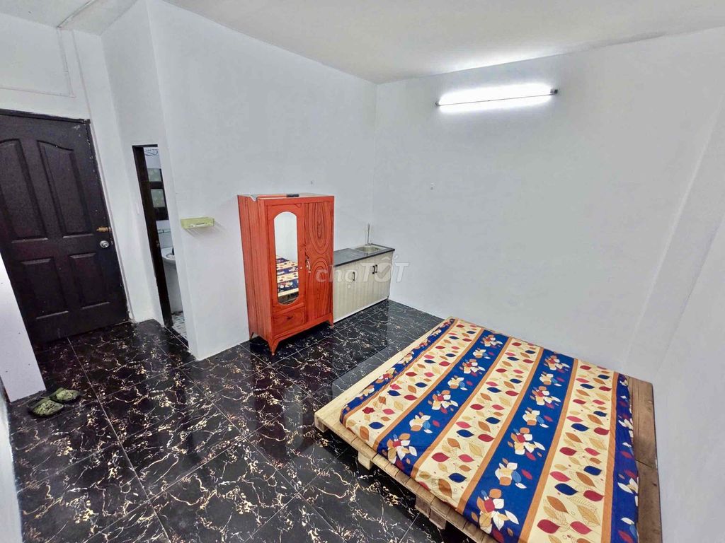 Nice new living room with air conditioning-- Tạ Quang Bửu Street, District 8 for 4.