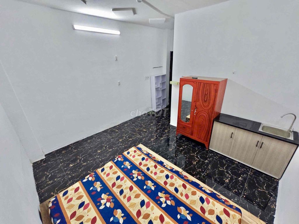 Nice new living room with air conditioning-- Tạ Quang Bửu Street, District 8 for 4.