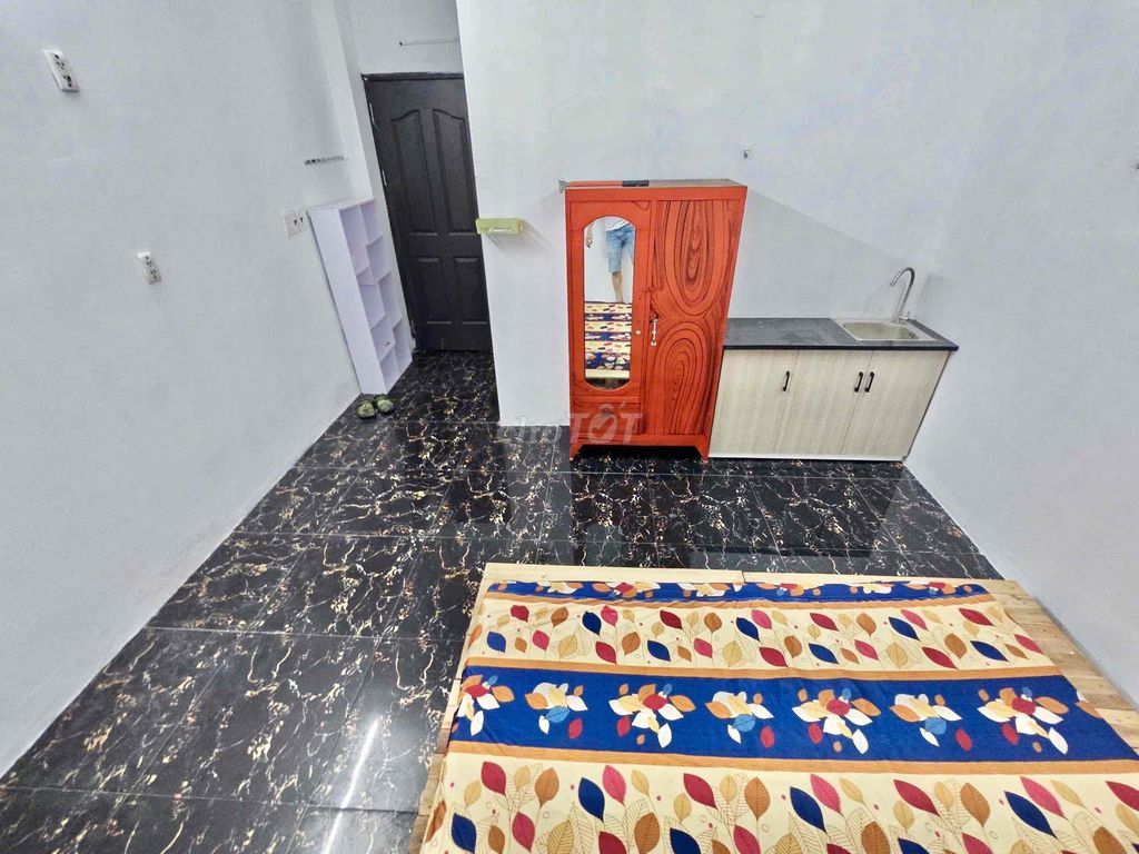 Nice new living room with air conditioning-- Tạ Quang Bửu Street, District 8 for 4.