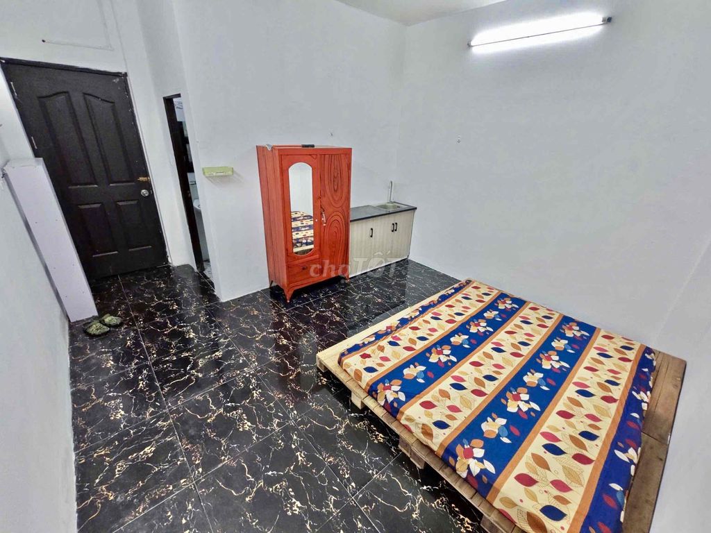 Nice new living room with air conditioning-- Tạ Quang Bửu Street, District 8 for 4.