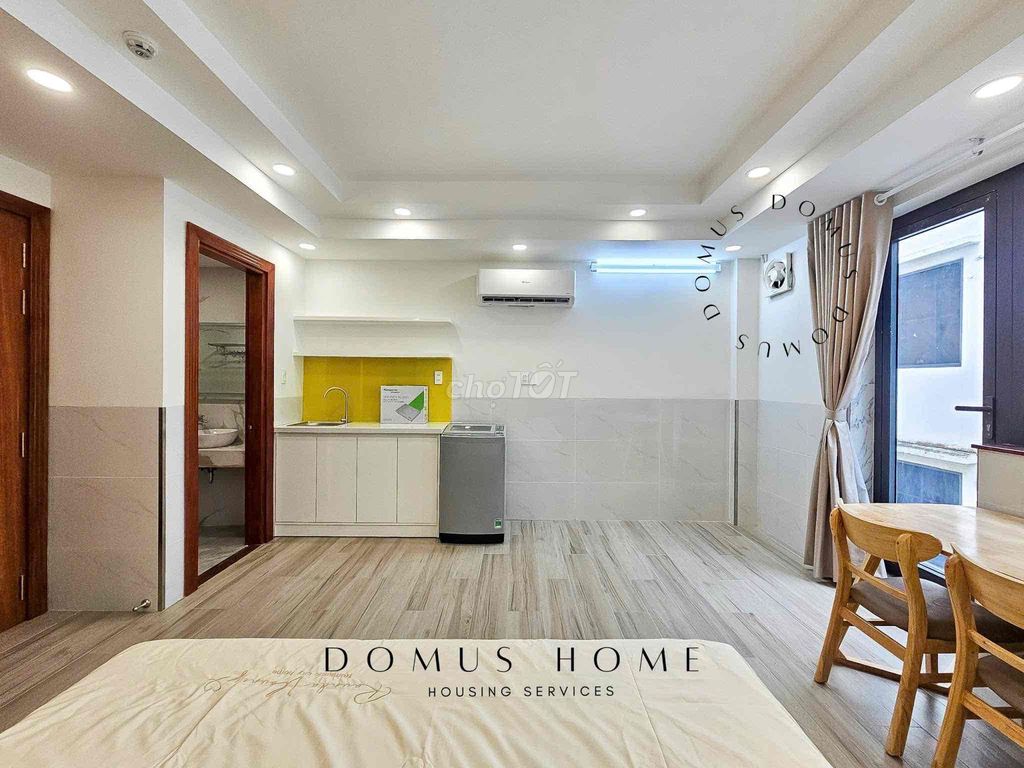 The studio apartment is full of furniture, open wide windows in the heart of District 7