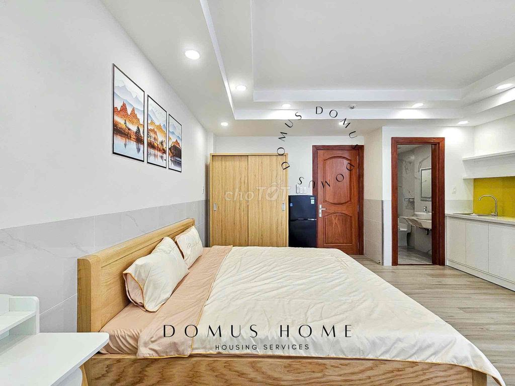 The studio apartment is full of furniture, open wide windows in the heart of District 7