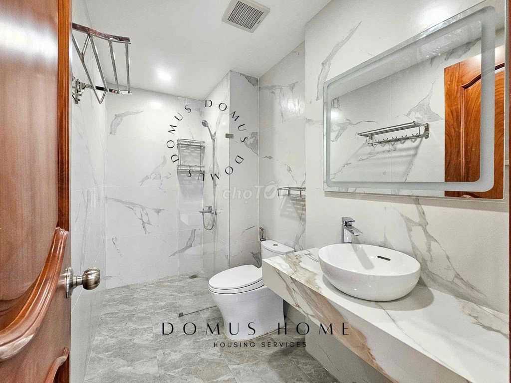 The studio apartment is full of furniture, open wide windows in the heart of District 7