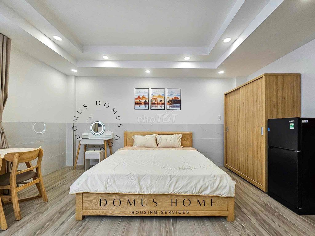 The studio apartment is full of furniture, open wide windows in the heart of District 7