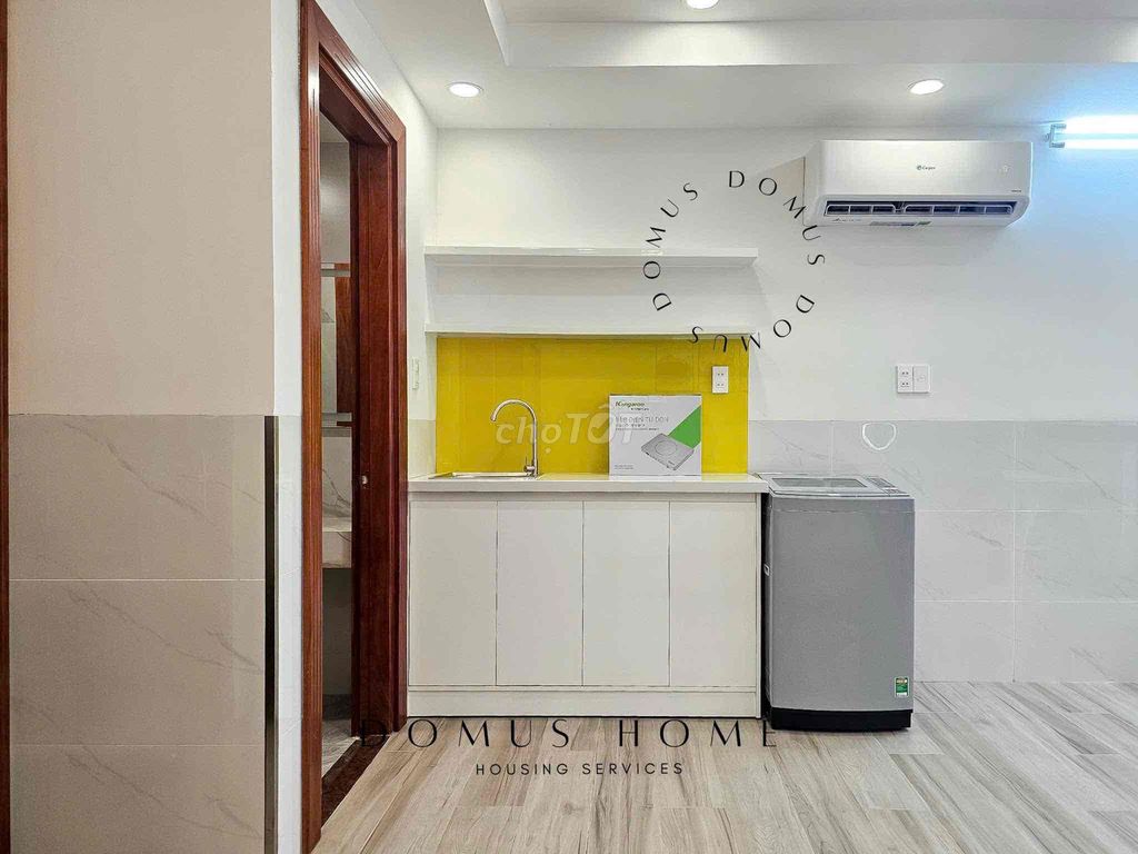 The studio apartment is full of furniture, open wide windows in the heart of District 7