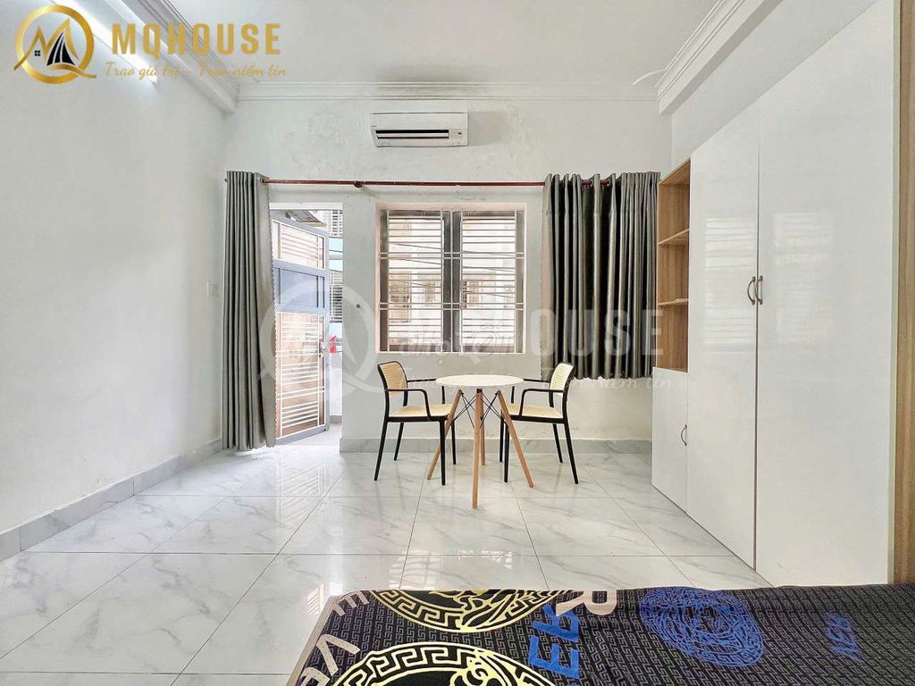 The 1st House, the balcony, splits the kitchen at 4 Phú Nhuận.