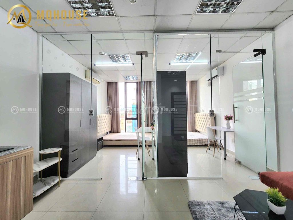 Two bedrooms one room. Full glass with curtains.