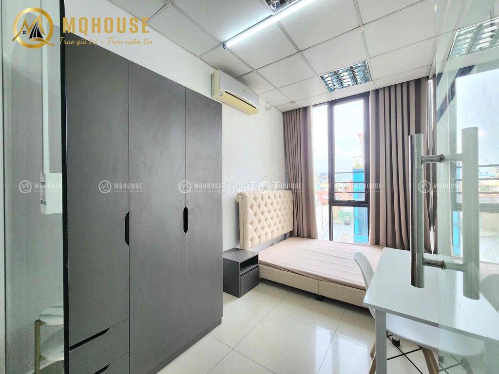 Two bedrooms one room. Full glass with curtains.