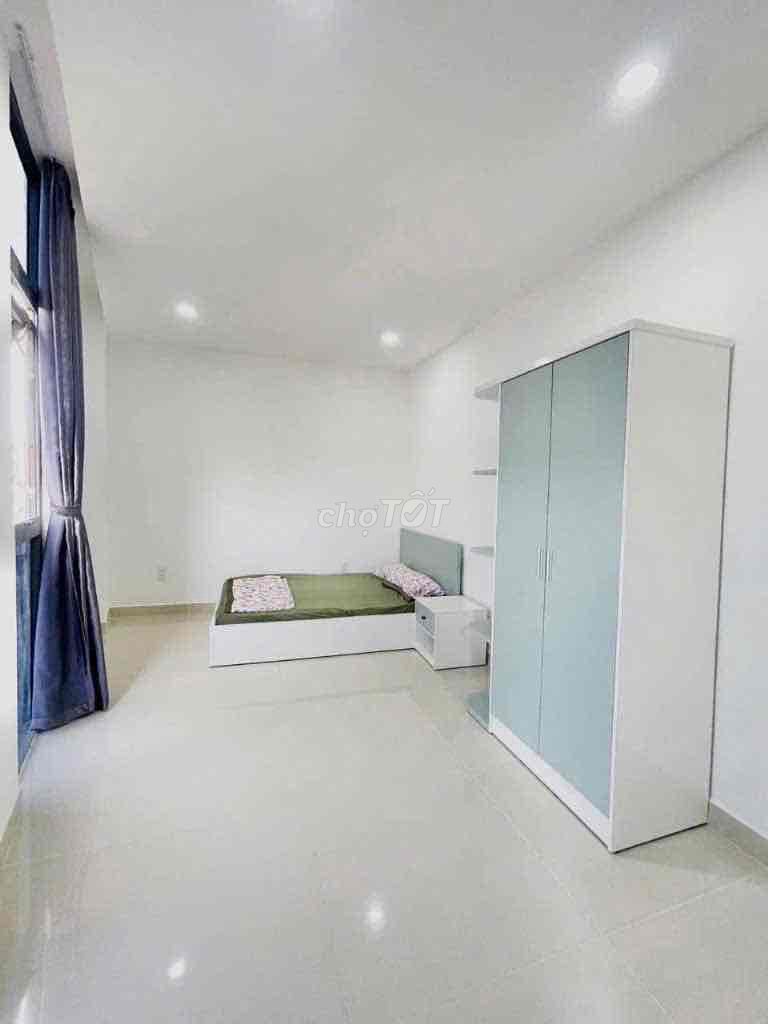 Two bedrooms on the road near a soft bridge.
