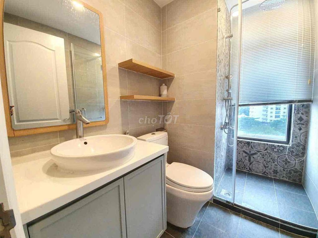 High school apartment 3 bedroom with a car coming out next to airport park.