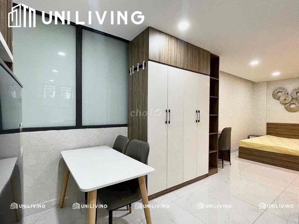 The studio's studio split kitchen full of furniture bordering its own marketing