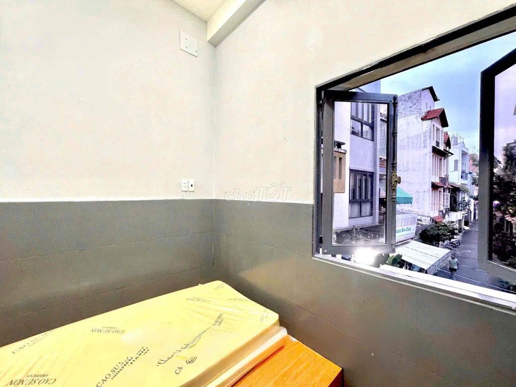 Room 2 sleep space, open window, full interior near the Constitution