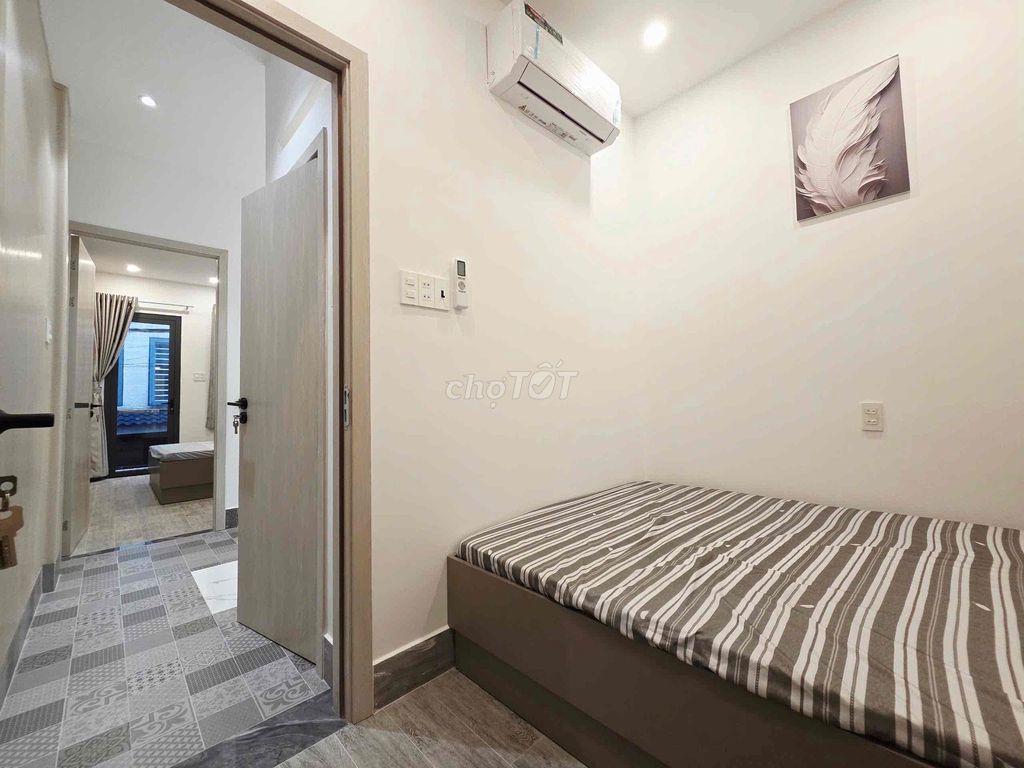 The original two bedrooms are full of furniture - ground one floor