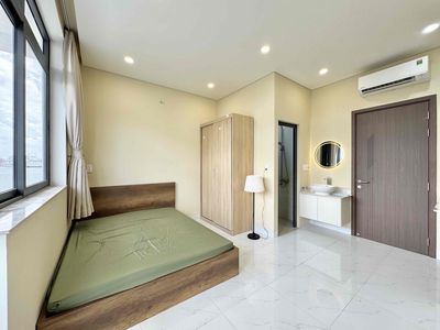 The mini apartment has a full block of furniture near the flower village park.