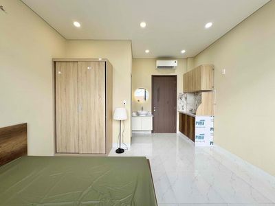 The mini apartment has a full block of furniture near the flower village park.