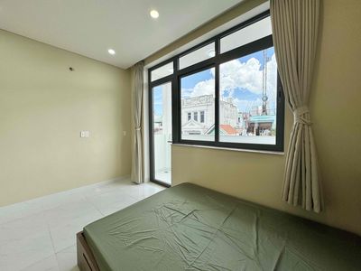 The mini apartment has a full block of furniture near the flower village park.