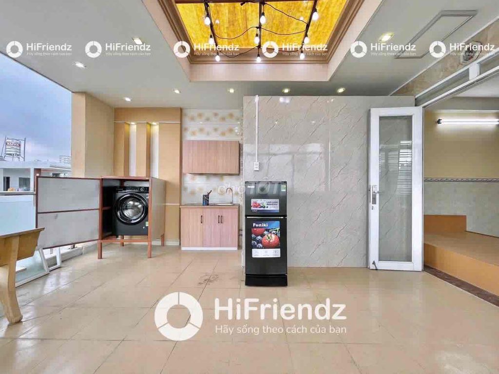 A two-sided kitchen with a private washing machine at Kinh Dương Vương.