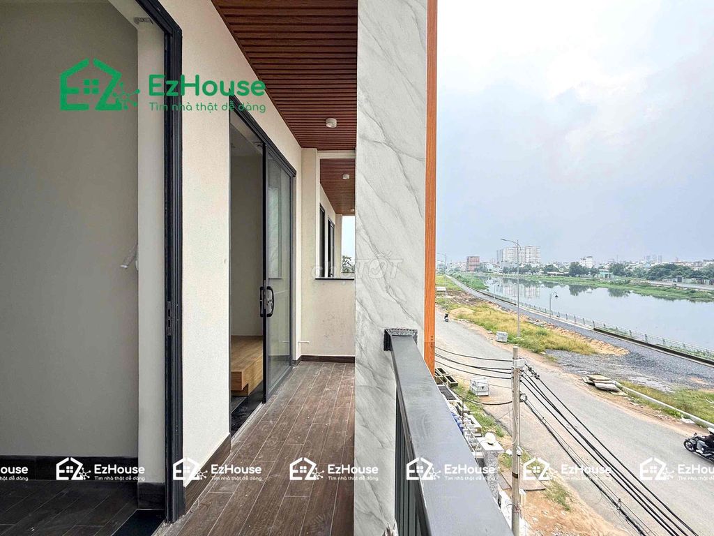 2 open bedrooms -- there's a balcony -- by the river -- full interiors.