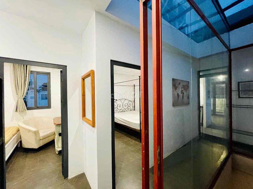 Two bedrooms with a balcony living room.