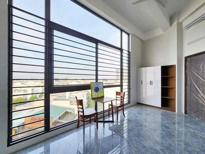 The service apartment has a balcony full of furniture downtown in District 7
