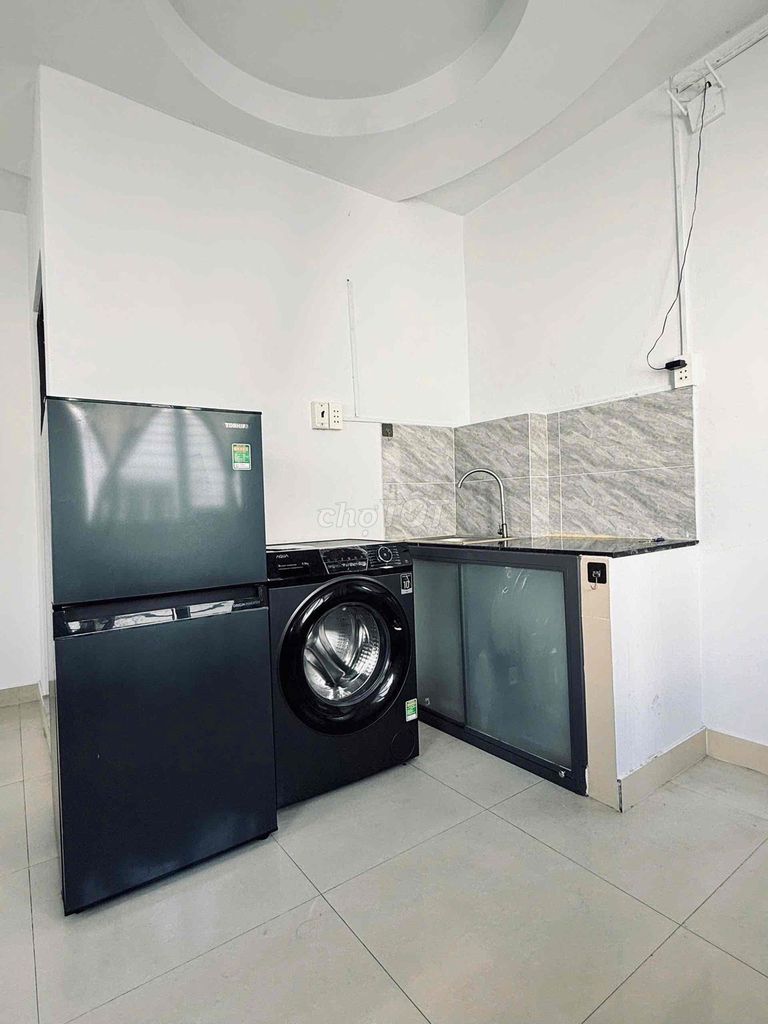 The window room is full of private washing machines right in front of cash