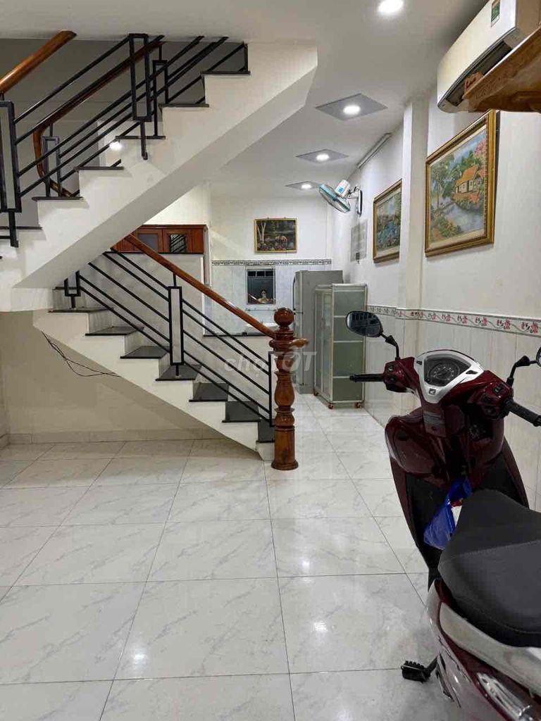 Two bedrooms have basic Phạm Văn Chiêu interiors.