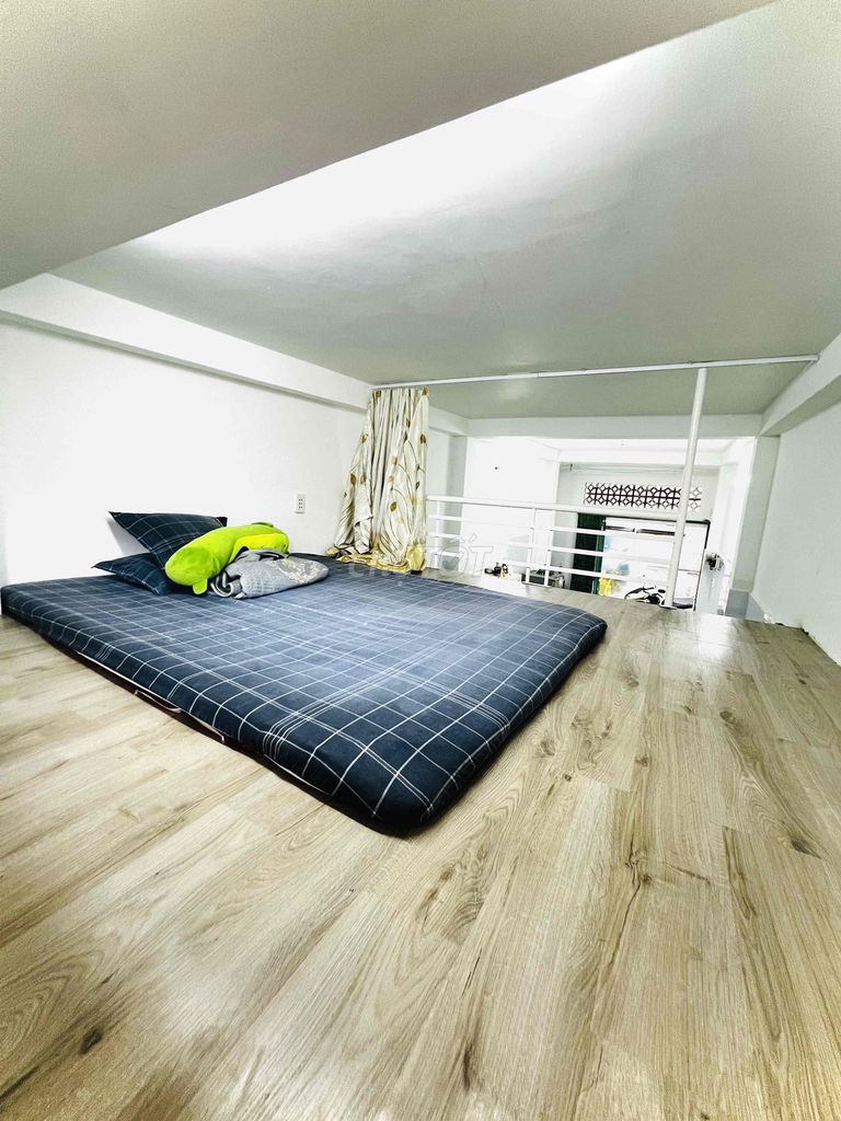 Two bedrooms and a car in the room.