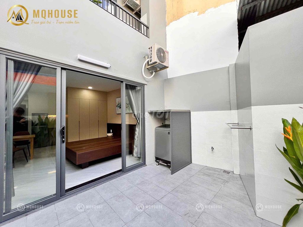 The penthouse balcony service room. A pan's got a whole modern set of furniture.