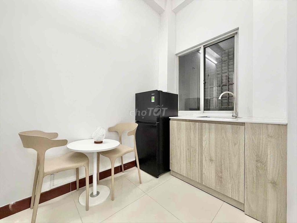 The kitchen room is full of furniture right near the T3 station.