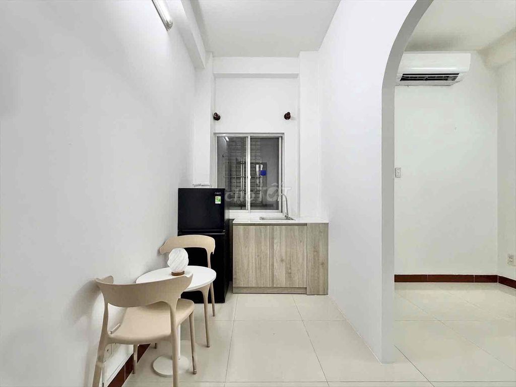 The kitchen room is full of furniture right near the T3 station.