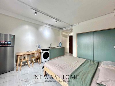 The big, cool window house is full of furniture with a new home washing machine.
