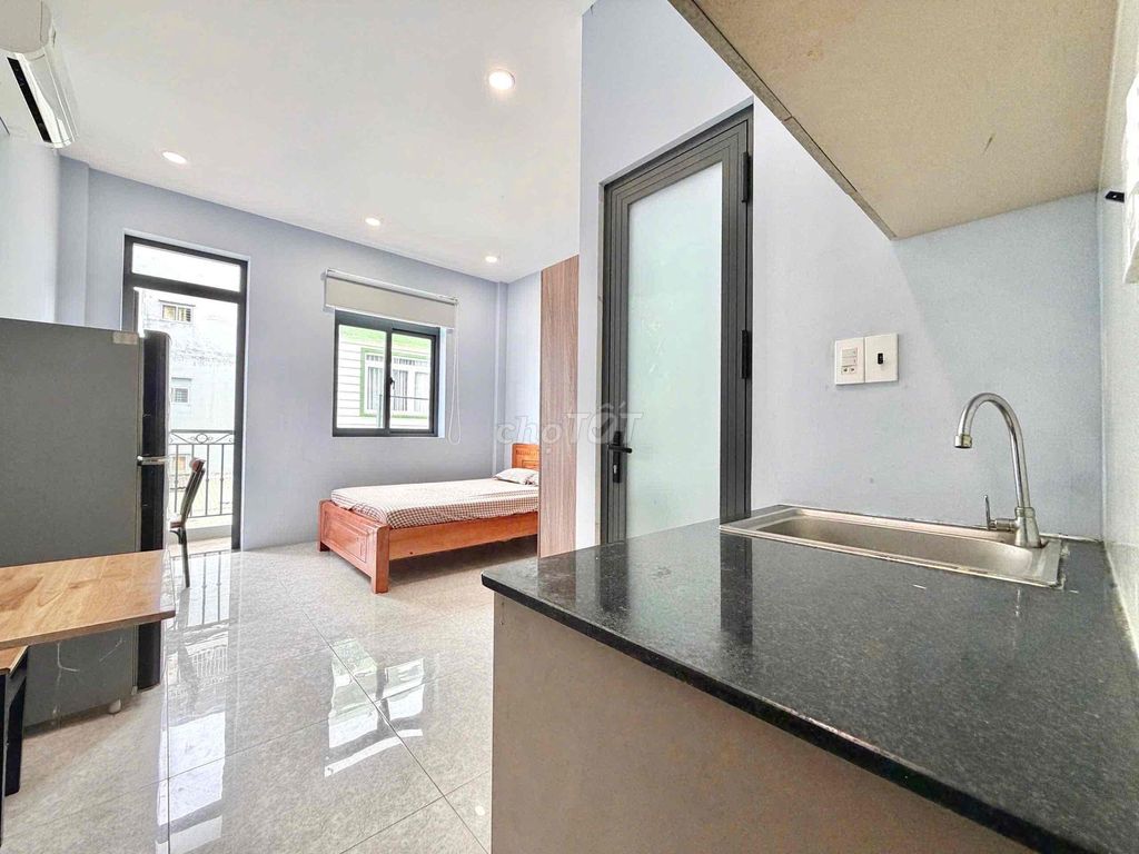 The 28-foot studio full of balconies can be located right here on the road.