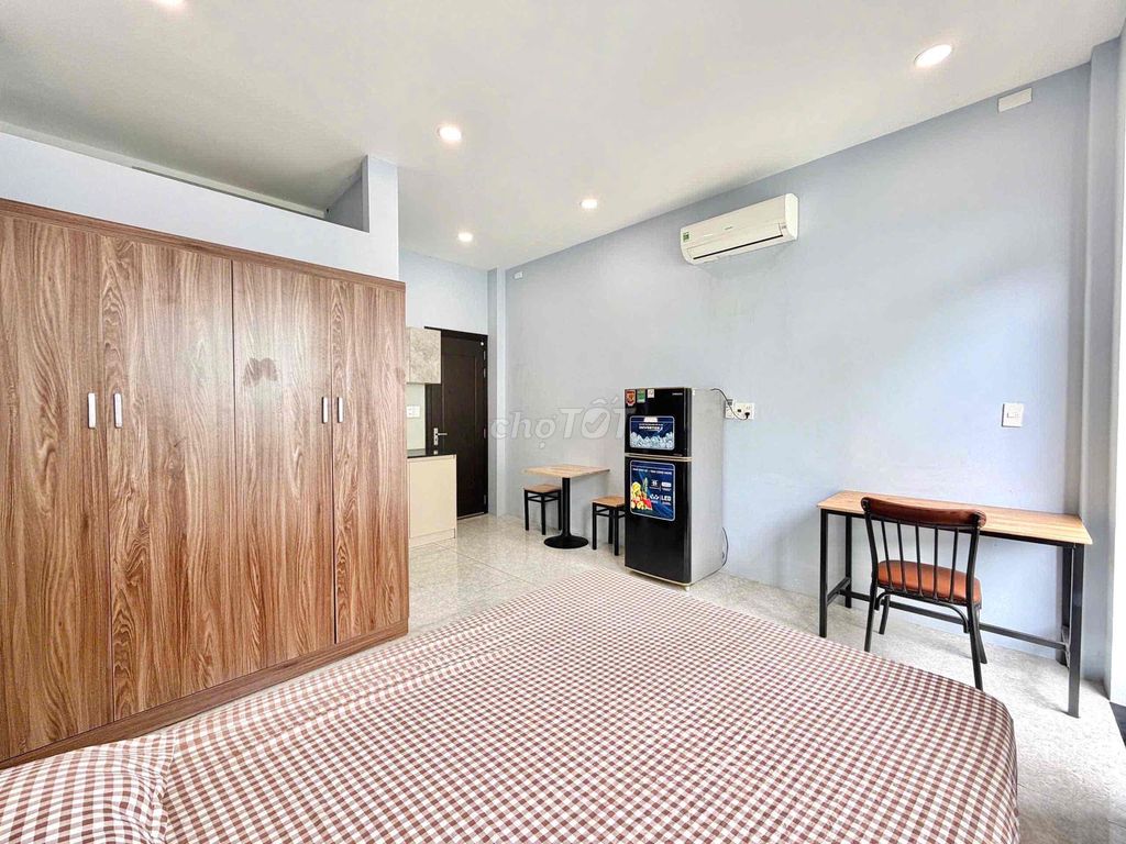 The 28-foot studio full of balconies can be located right here on the road.