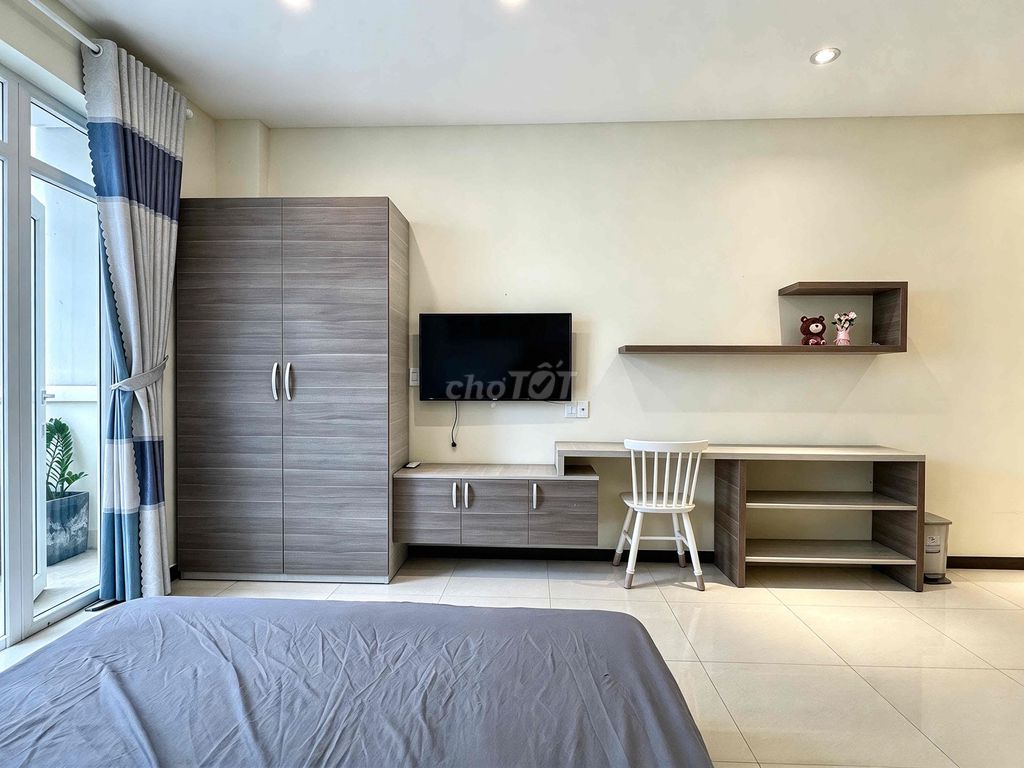 The mini-size building near the bridge has a rented room.