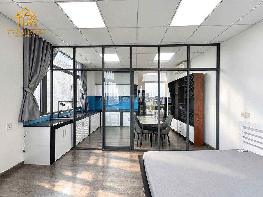 A super estate suite. A bedroom-- a balcony -- separate kitchen -- right into the page.