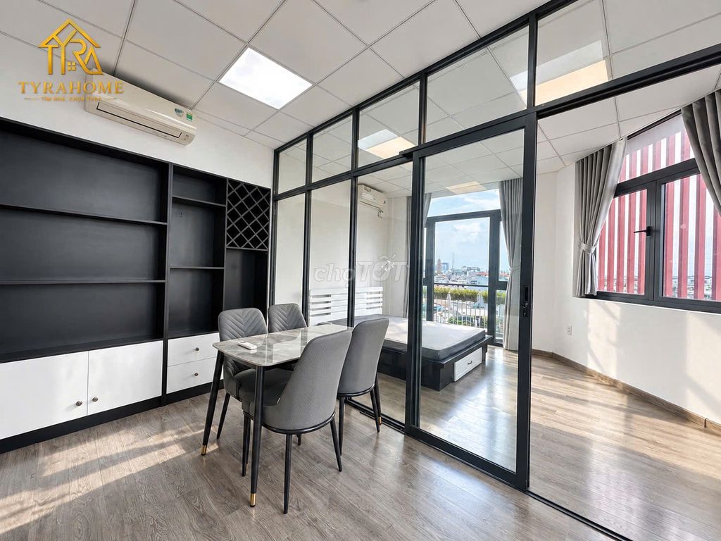 A super estate suite. A bedroom-- a balcony -- separate kitchen -- right into the page.