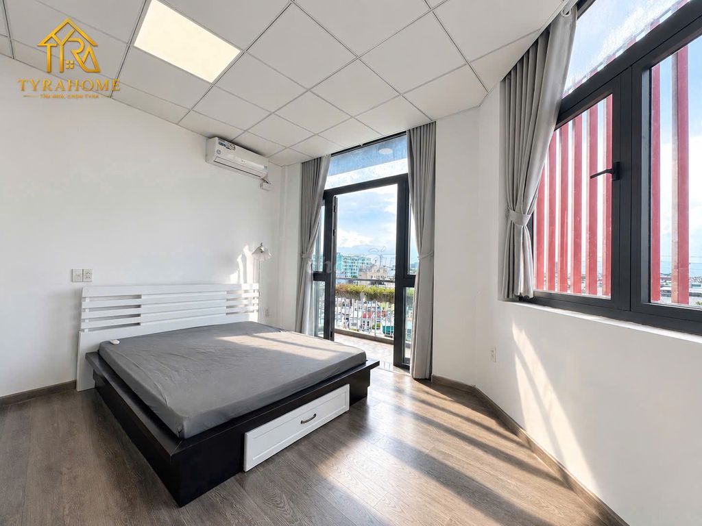 A super estate suite. A bedroom-- a balcony -- separate kitchen -- right into the page.